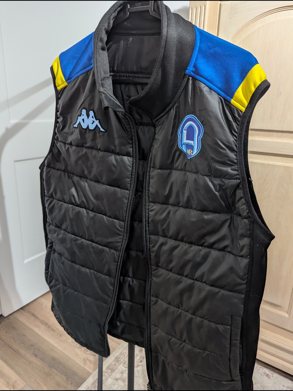 Black Puffer Vest with Blue & Yellow Accents